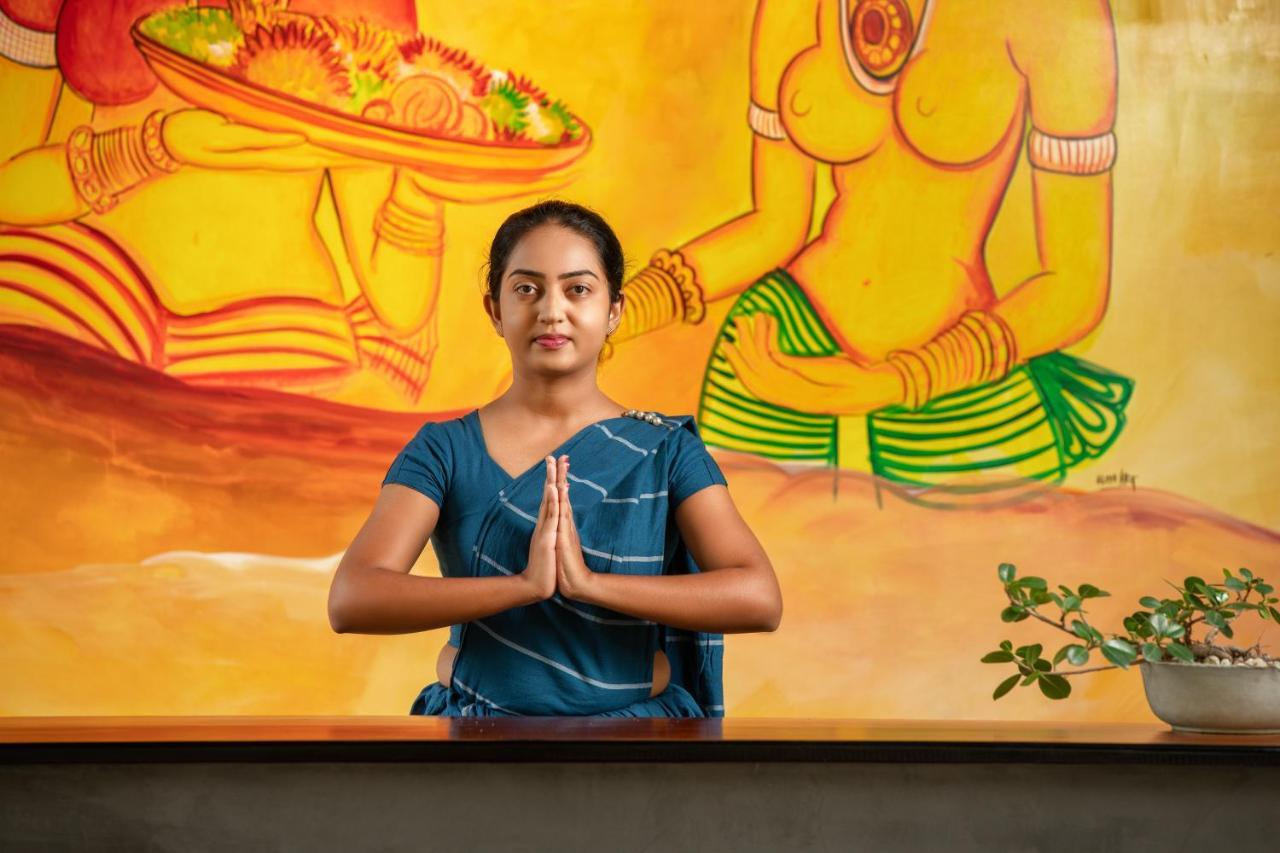Atha Resort Sigiriya Ngoại thất bức ảnh A woman greeting with Namaste